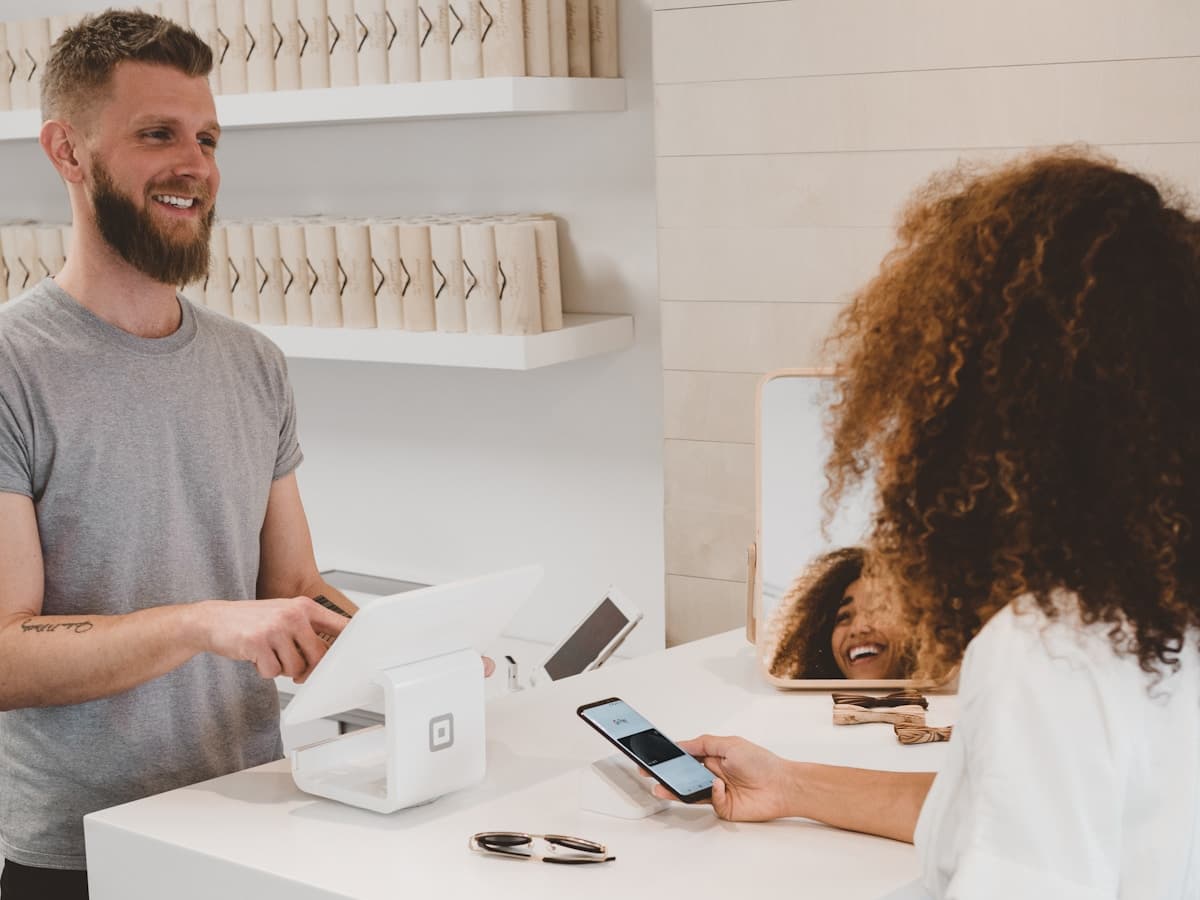 A payment terminal and a ticket. The step that writes into the venue’s own systems.